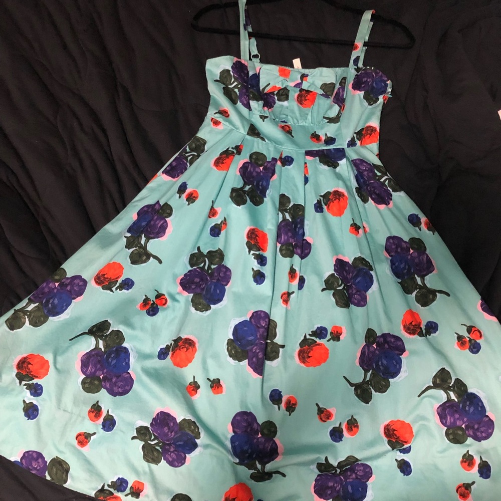 COPY - Floral sundress with adjustable straps, pockets and zipper on left side.